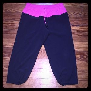 NWOT! Black/Pink Lululemon Capri pants.